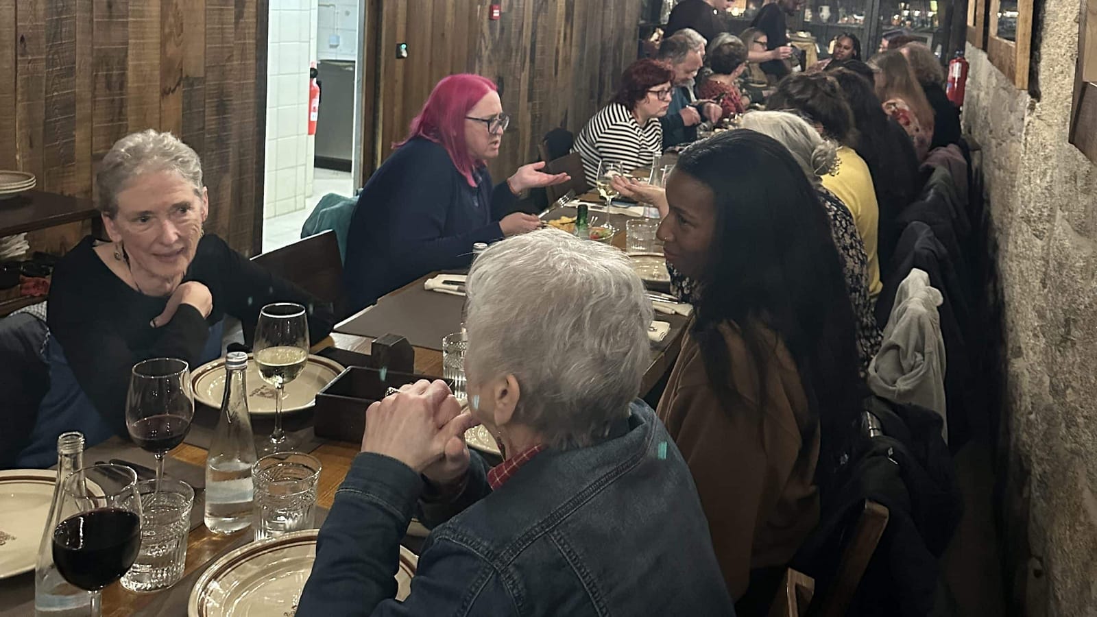 Americans on an Expatsi scouting trip sharing a long table over dinner