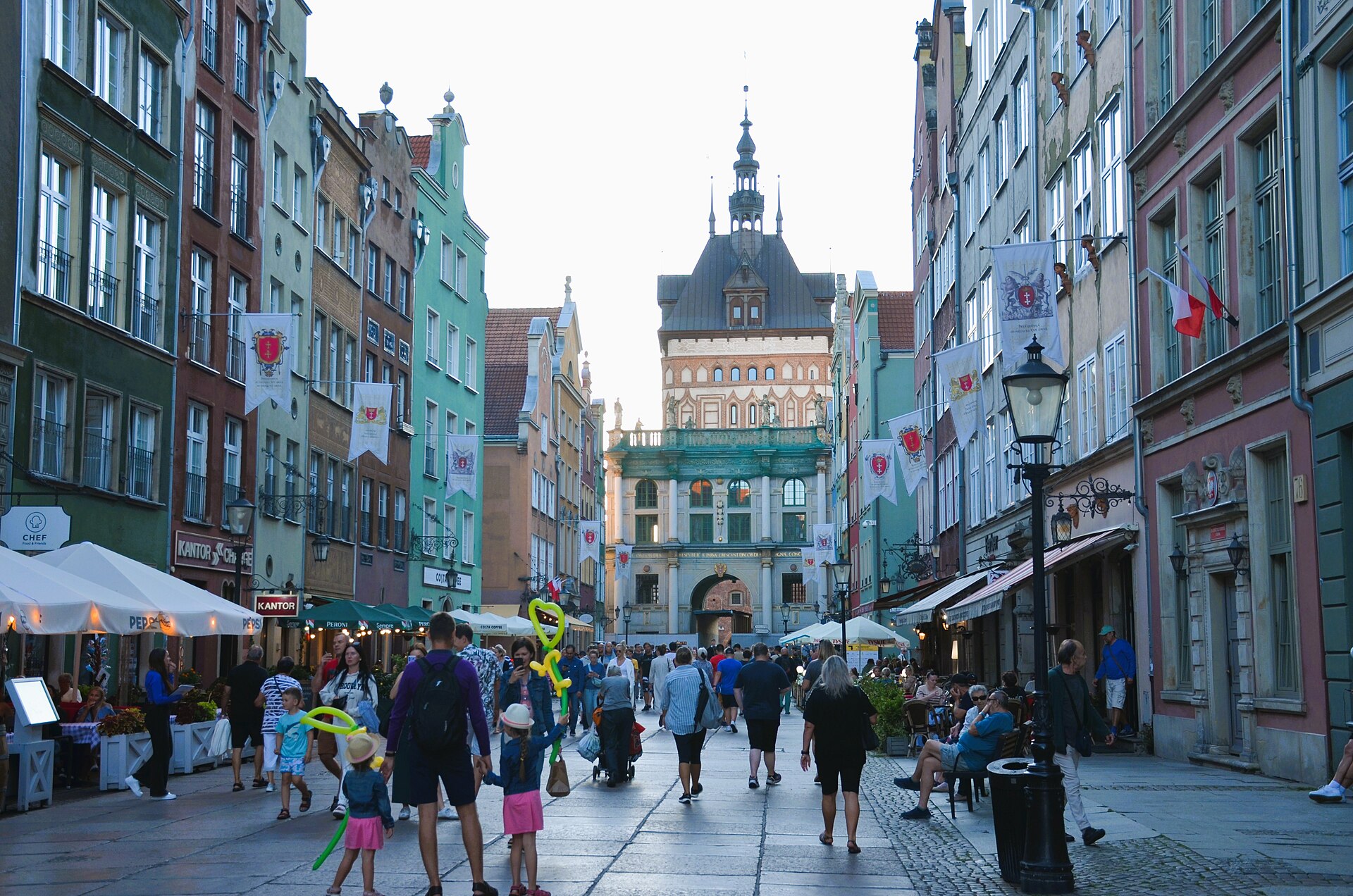 People walking past cafe terraces on the Long Market in Gdansk, Poland